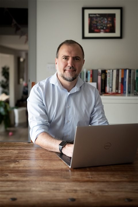 Joseph Birkby, founder of Nomovera, working at a laptop
